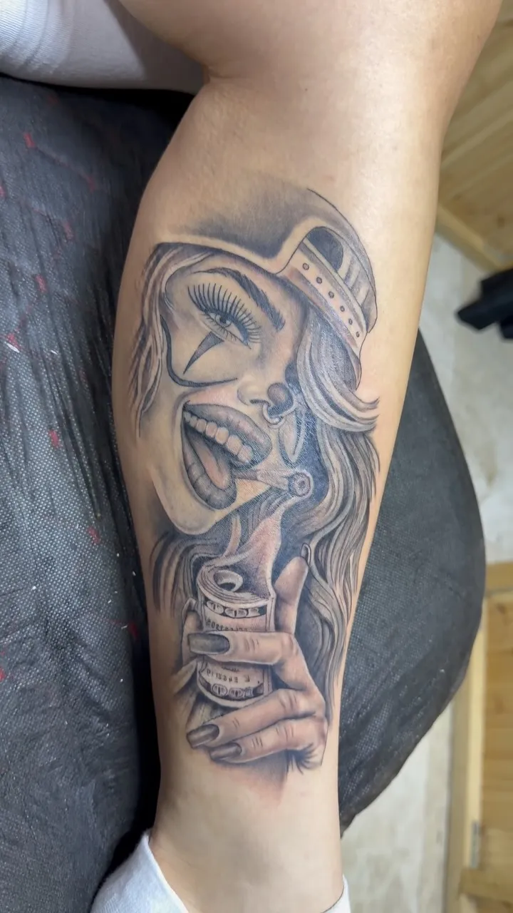 Black and grey chicano-style warrior woman tattoo
