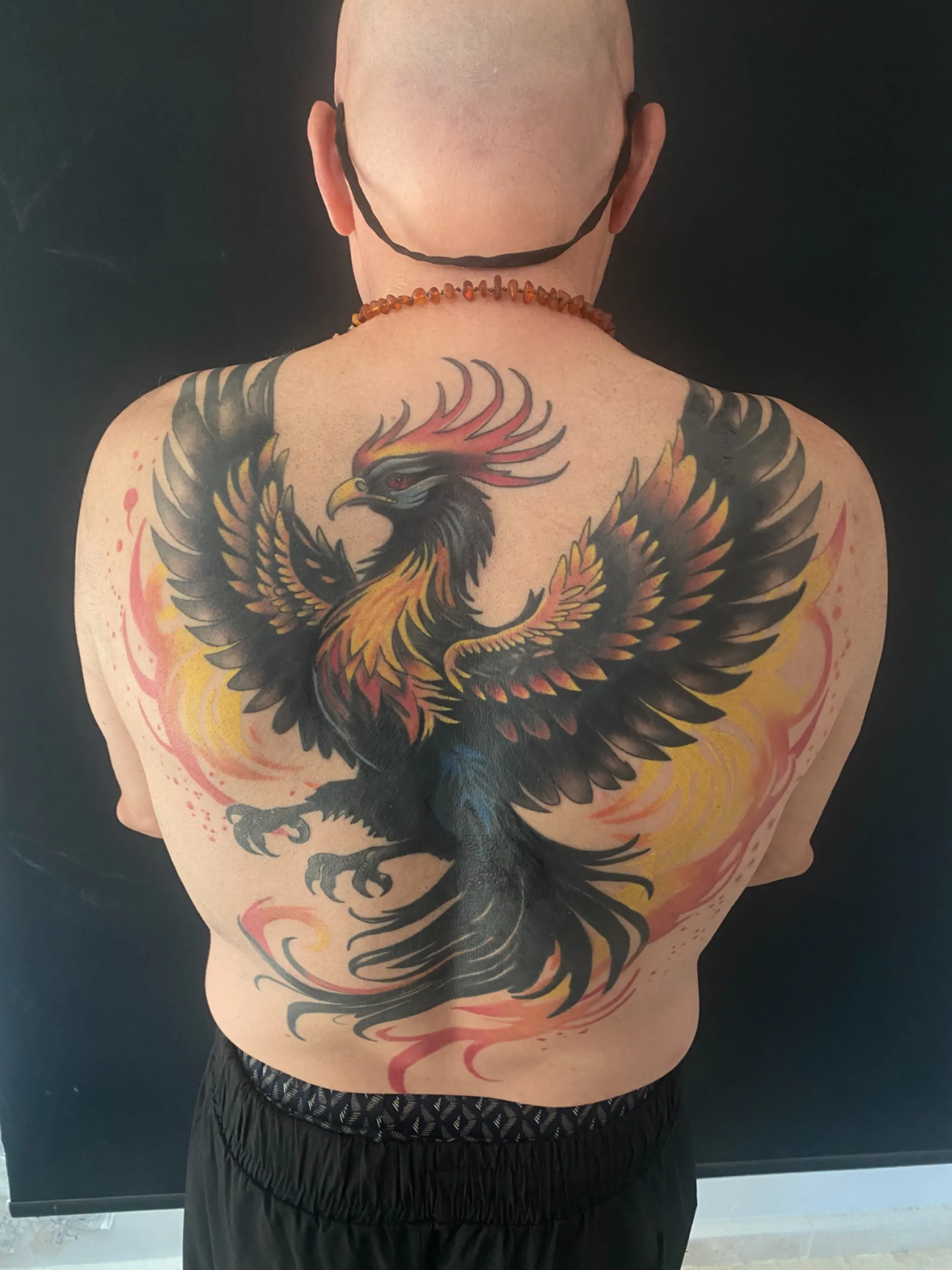 Large colour phoenix back tattoo