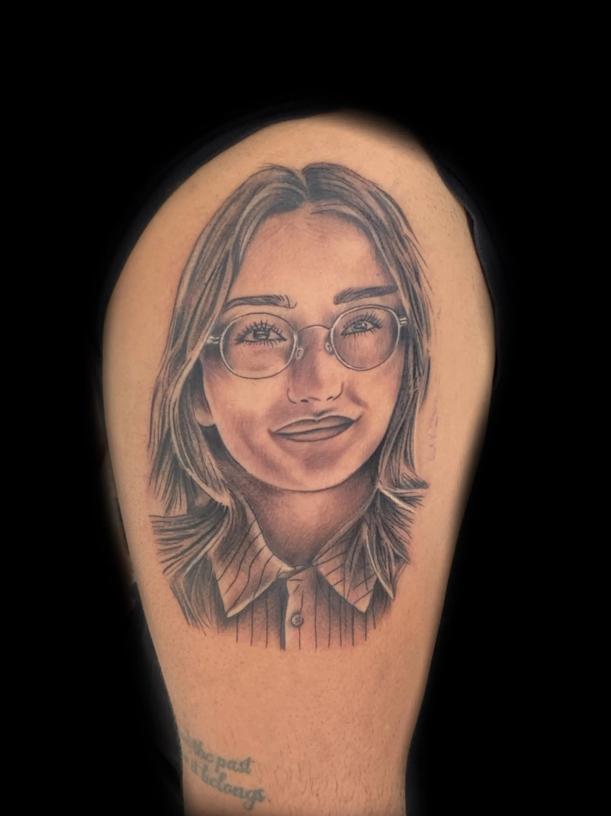 Black and grey realistic portrait tattoo of a woman